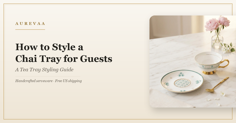 A step-by-step tea tray styling guide covering the tray, cups, coasters, spoons, a tea strainer and a tiered stand — plus easy ideas to serve chai beautifully. Shop handcrafted Aurevaa serveware. 