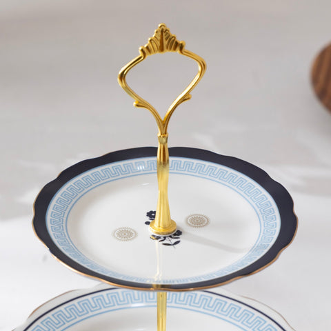 Close-up of the 24K gold-plated stainless steel handle on the ceramic cake stand