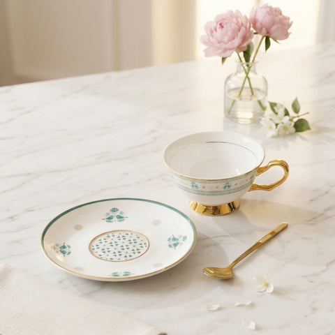 Emerald Bird bone china tea cup and saucer with blue leaf motifs and 24K gold rim