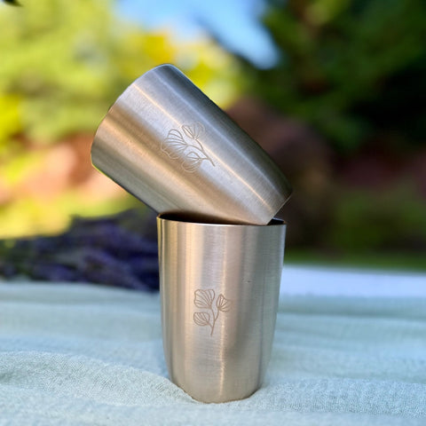 Kansa Cups Staked Over Each Other in an outdoor setting.