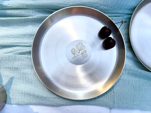Kansa snack plate with floral motif top with cherry