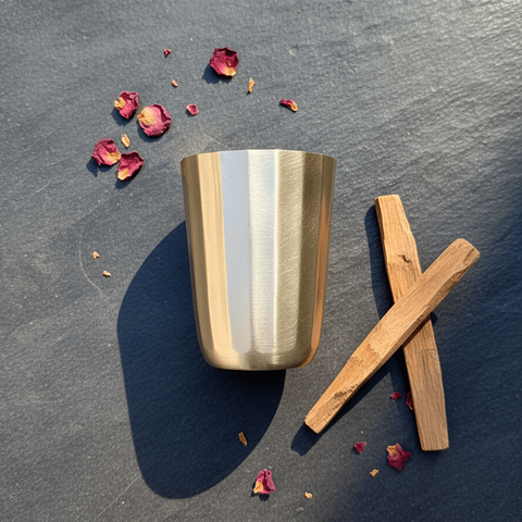 Leaf kansa cup in polished bell metal with a clean fluted silhouette