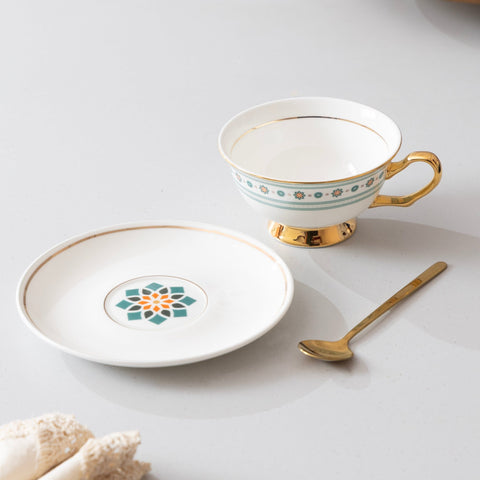 Teal Bloom tea cup and saucer styled for a coffee or chai ritual