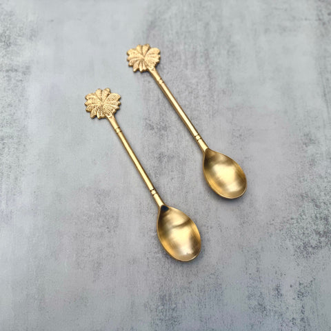 Palm brass serving spoon set of two with palm-leaf motif handles in golden brass