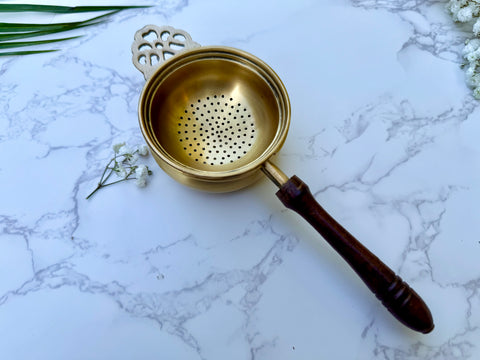 Handcrafted brass tea strainer with wooden handle for Indian chai top