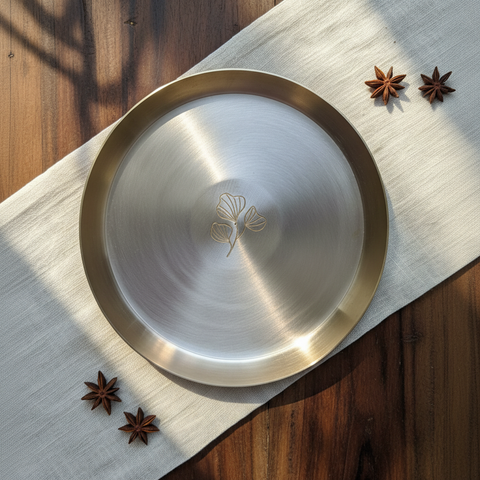 Kansa plate with placed on a cloth with star anise