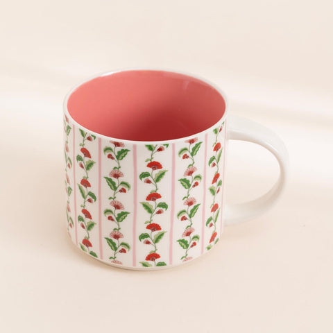 Crimson Bloom ceramic mug with red floral design and pink interior